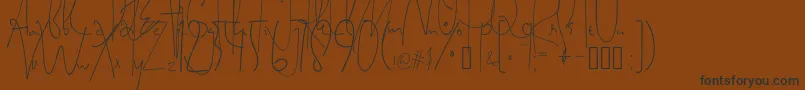 フォントSatriyaMayaHandwriting – 黒い文字が茶色の背景にあります