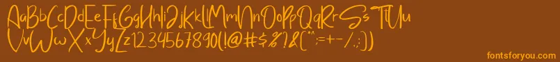 Sayangable Font – Orange Fonts on Brown Background