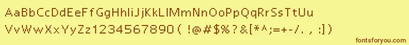 フォントReactor7 – 茶色の文字が黄色の背景にあります。