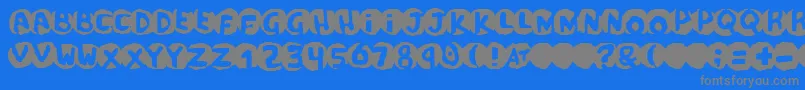 フォントscandal – 青い背景に灰色の文字