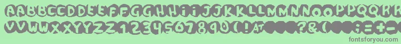 scandal Font – Gray Fonts on Green Background