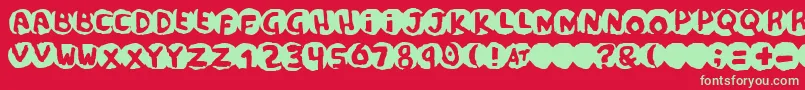 scandal Font – Green Fonts on Red Background