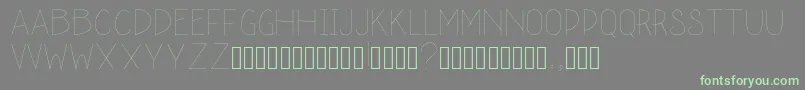schoolah thin-Schriftart – Grüne Schriften auf grauem Hintergrund