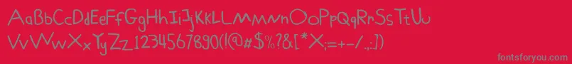 Schoolboy Sam-Schriftart – Graue Schriften auf rotem Hintergrund