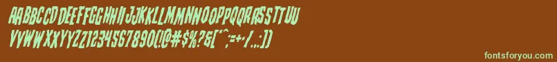 フォントCreepycrawlersstagital – 緑色の文字が茶色の背景にあります。