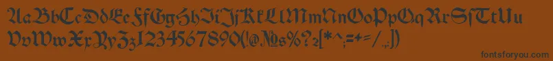 Schwaben Alt Bold-Schriftart – Schwarze Schriften auf braunem Hintergrund