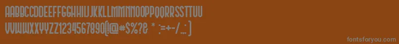 Schwarzenberg-fontti – harmaat kirjasimet ruskealla taustalla