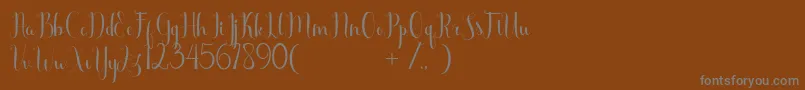 フォントScooter Free – 茶色の背景に灰色の文字