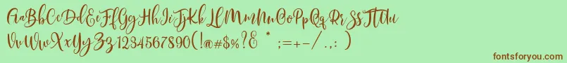 Fonte Scoothlane Script Demo Version – fontes marrons em um fundo verde