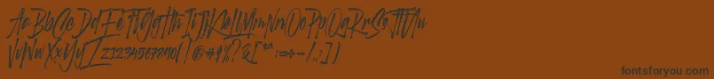 フォントScotland stories DEMO – 黒い文字が茶色の背景にあります