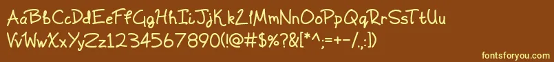 Scrawling Pad Font – Yellow Fonts on Brown Background