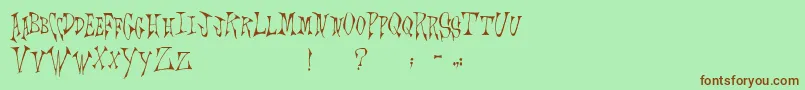 Scrawlings Font – Brown Fonts on Green Background