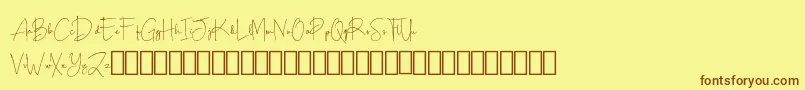 フォントScripty Demo – 茶色の文字が黄色の背景にあります。