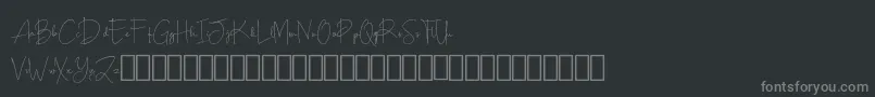 Fonte Scripty Demo – fontes cinzas em um fundo preto
