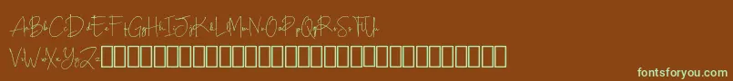フォントScripty Demo – 緑色の文字が茶色の背景にあります。