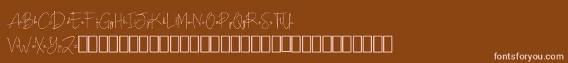 フォントScripty Demo – 茶色の背景にピンクのフォント