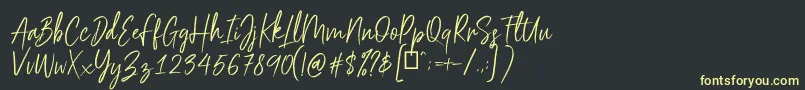 フォントScriptyca – 黒い背景に黄色の文字