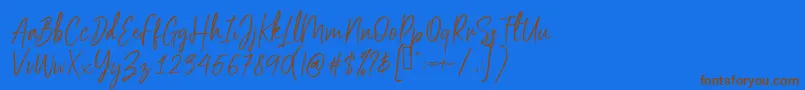 Scriptyca Font – Brown Fonts on Blue Background