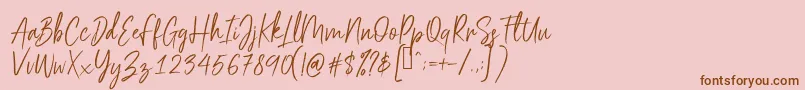 Scriptyca-Schriftart – Braune Schriften auf rosa Hintergrund