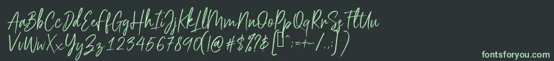 フォントScriptyca – 黒い背景に緑の文字