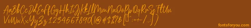 Scriptyca Font – Orange Fonts on Brown Background
