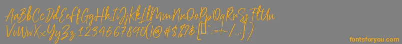 Scriptyca Font – Orange Fonts on Gray Background