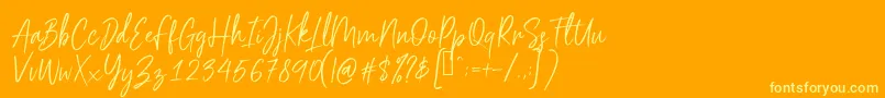 フォントScriptyca – オレンジの背景に黄色の文字