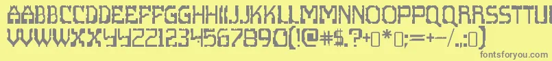 フォントscritzy x – 黄色の背景に灰色の文字