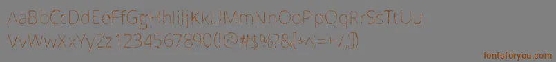 Scrizbels Font – Brown Fonts on Gray Background