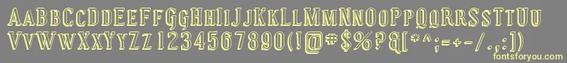 Sfcovingtonscshadow-fontti – keltaiset fontit harmaalla taustalla