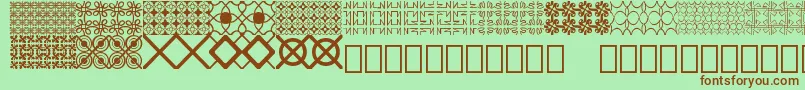 Шрифт Seamless patterns Demo – коричневые шрифты на зелёном фоне