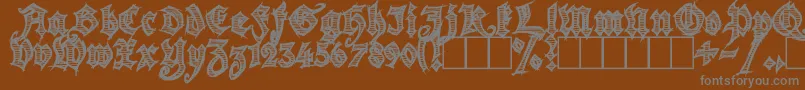 Season of the Witch-Schriftart – Graue Schriften auf braunem Hintergrund