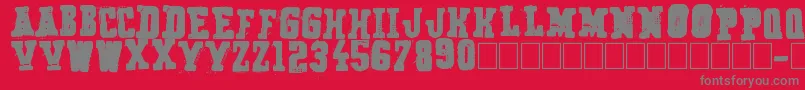 Secret Agency-fontti – harmaat kirjasimet punaisella taustalla