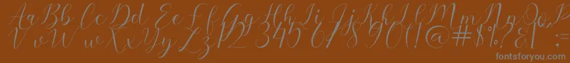 Sehaty-fontti – harmaat kirjasimet ruskealla taustalla