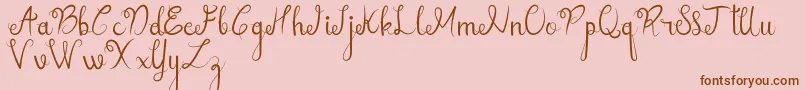 sellebeew demo-Schriftart – Braune Schriften auf rosa Hintergrund