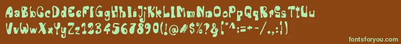 フォントSenior Artist – 緑色の文字が茶色の背景にあります。