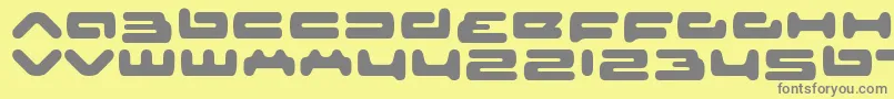senior service-fontti – harmaat kirjasimet keltaisella taustalla
