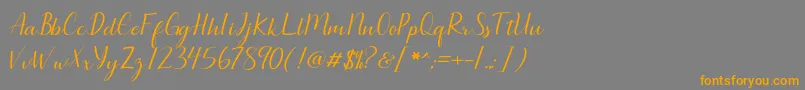 Seullanga script-Schriftart – Orangefarbene Schriften auf grauem Hintergrund