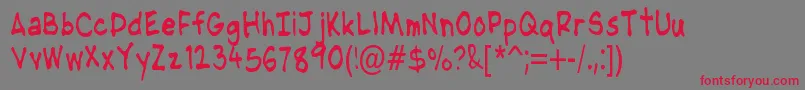 NipcensHandwritingCondensed Font – Red Fonts on Gray Background