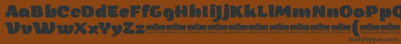 ArturoHeavyTrial Font – Black Fonts on Brown Background