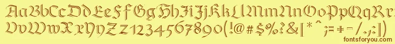 フォントRichmondzierschriftLtRegular – 茶色の文字が黄色の背景にあります。