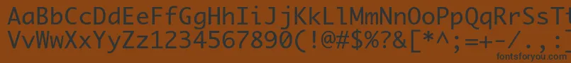 フォントPriamojc – 黒い文字が茶色の背景にあります