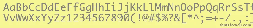 フォントPriamojc – 黄色の背景に灰色の文字