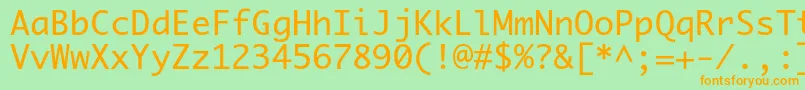 フォントPriamojc – オレンジの文字が緑の背景にあります。