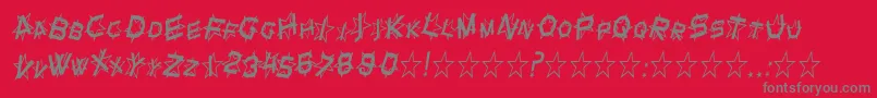 SF Star Dust Condensed Italic-fontti – harmaat kirjasimet punaisella taustalla