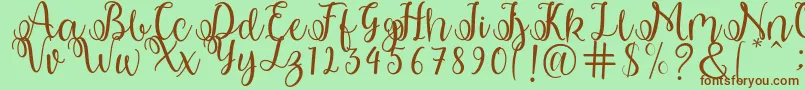 shabila Font – Brown Fonts on Green Background