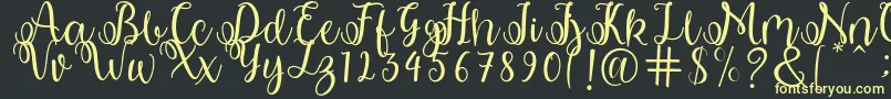 shabila Font – Yellow Fonts on Black Background