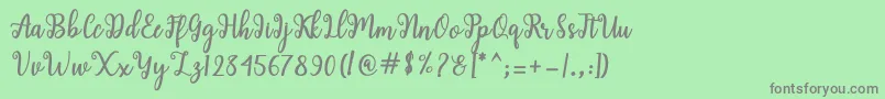 Shaila Script Font – Gray Fonts on Green Background