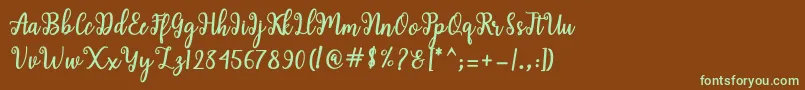 フォントShaila Script – 緑色の文字が茶色の背景にあります。