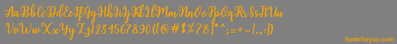 Shaila Script Font – Orange Fonts on Gray Background